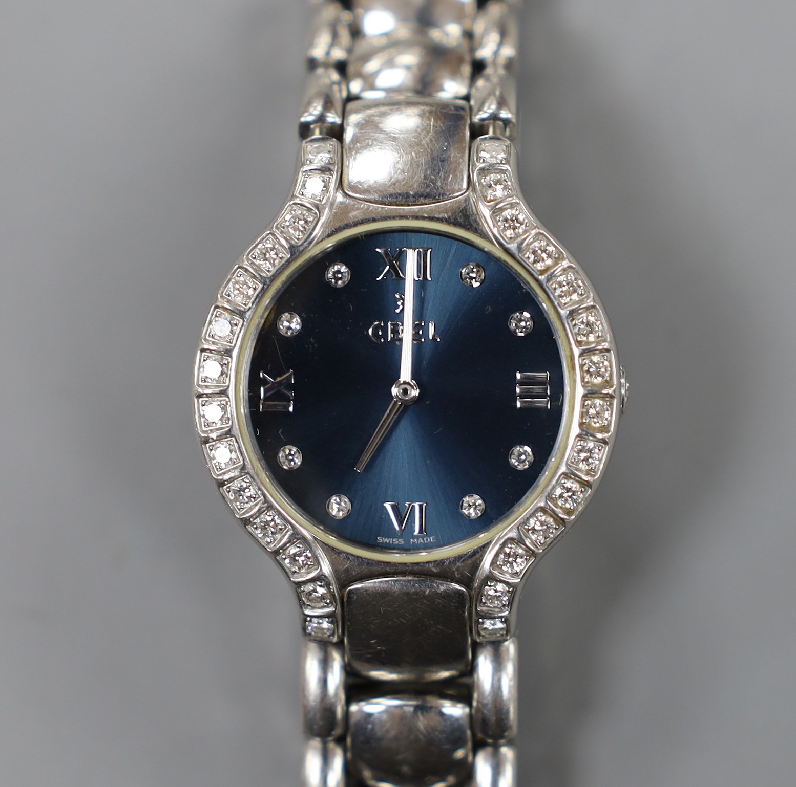 A lady's modern stainless steel Ebel quartz wrist watch and bracelet with diamond set dial and bezel, with box and papers.